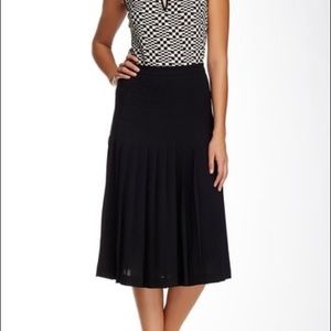 trina turk 〰️ allie pleated black midi skirt